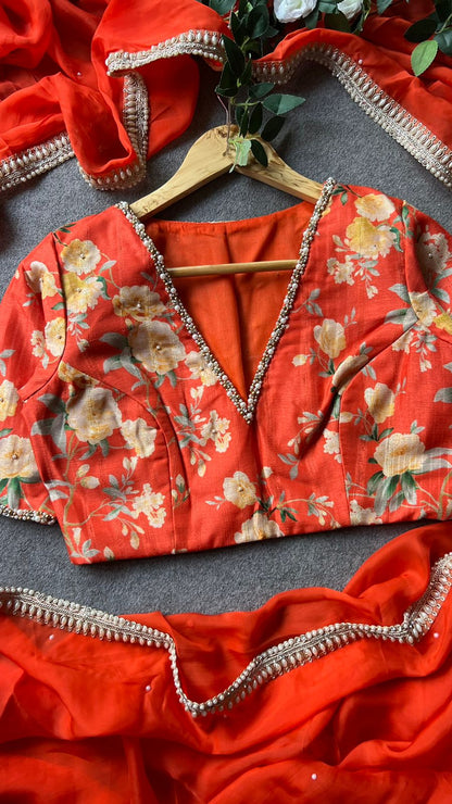 Orange organza saree with pearl hand work blouse