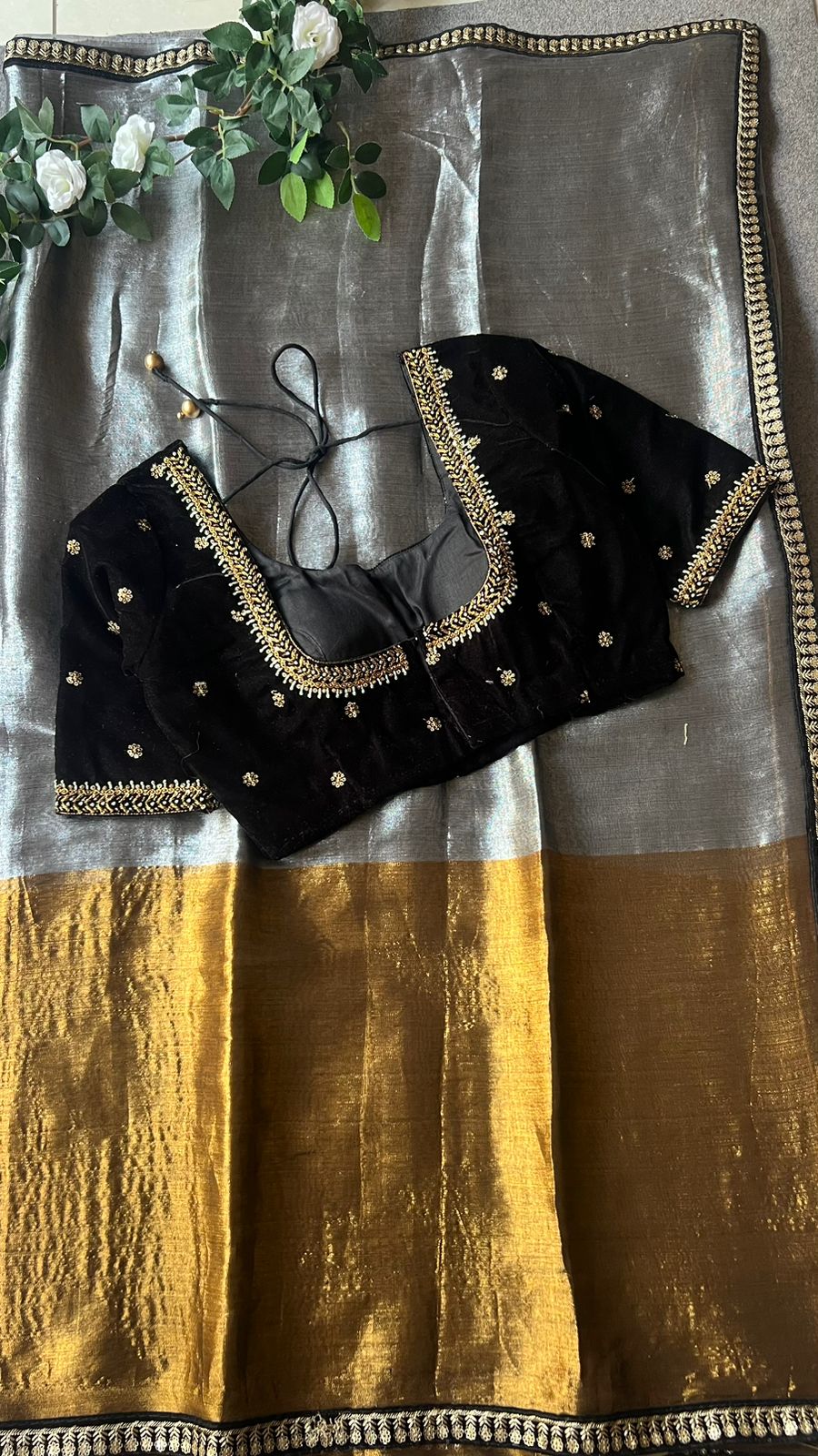 Silver tissue saree with black velvet hand worked blouse