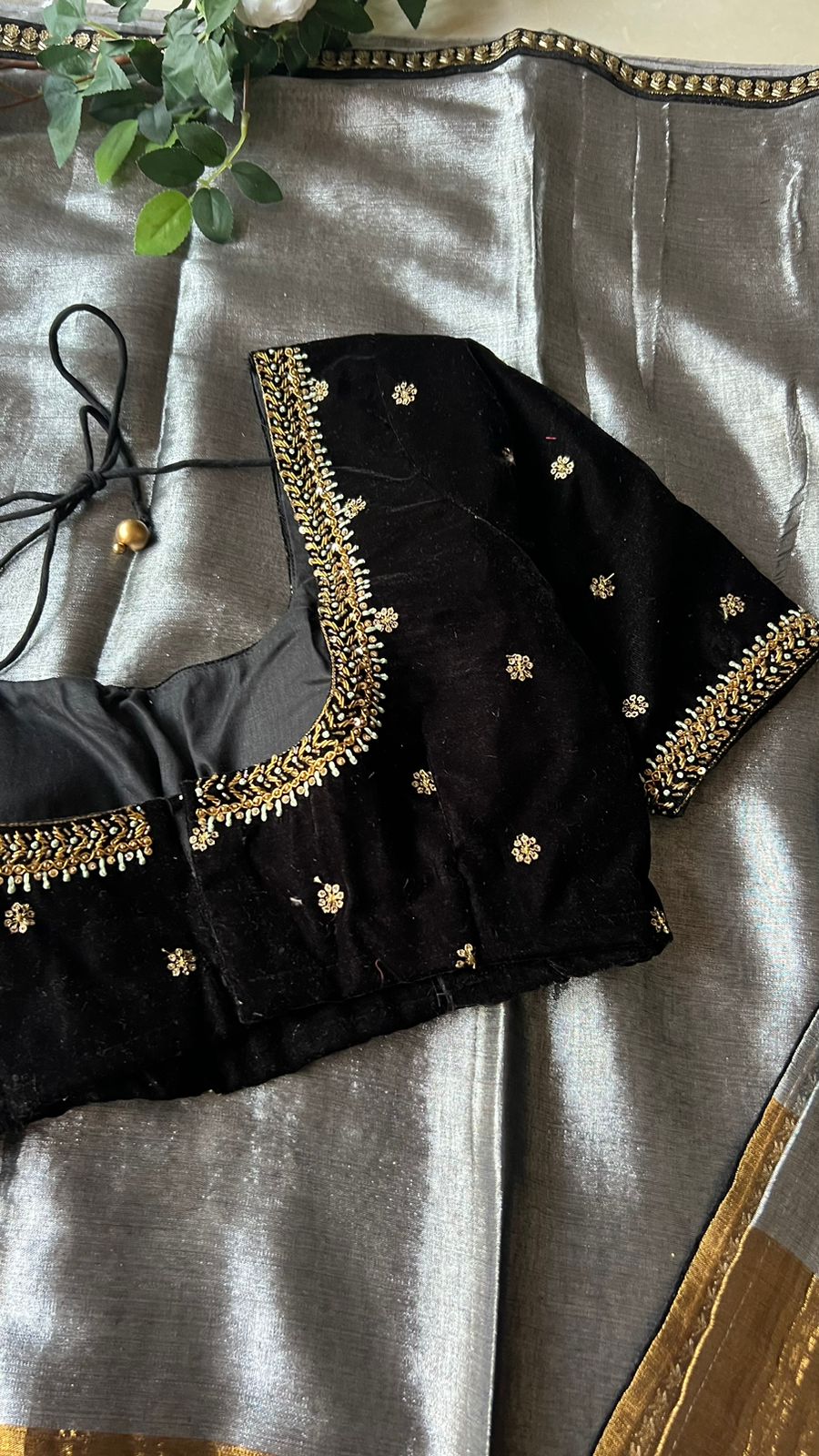 Silver tissue saree with black velvet hand worked blouse