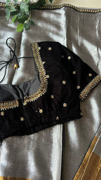Silver tissue saree with black velvet hand worked blouse