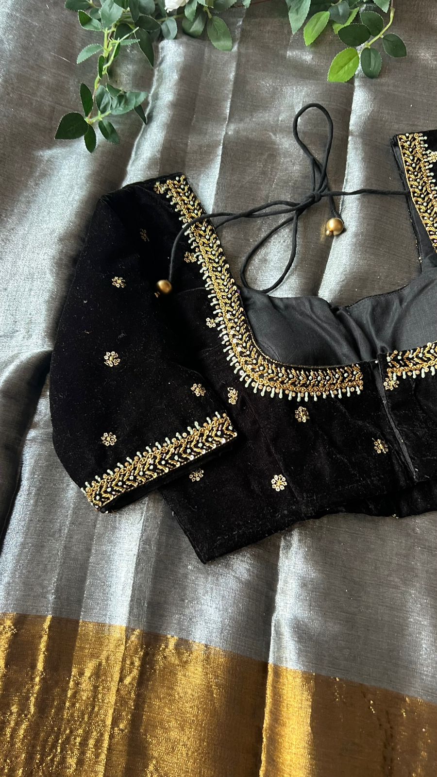 Silver tissue saree with black velvet hand worked blouse