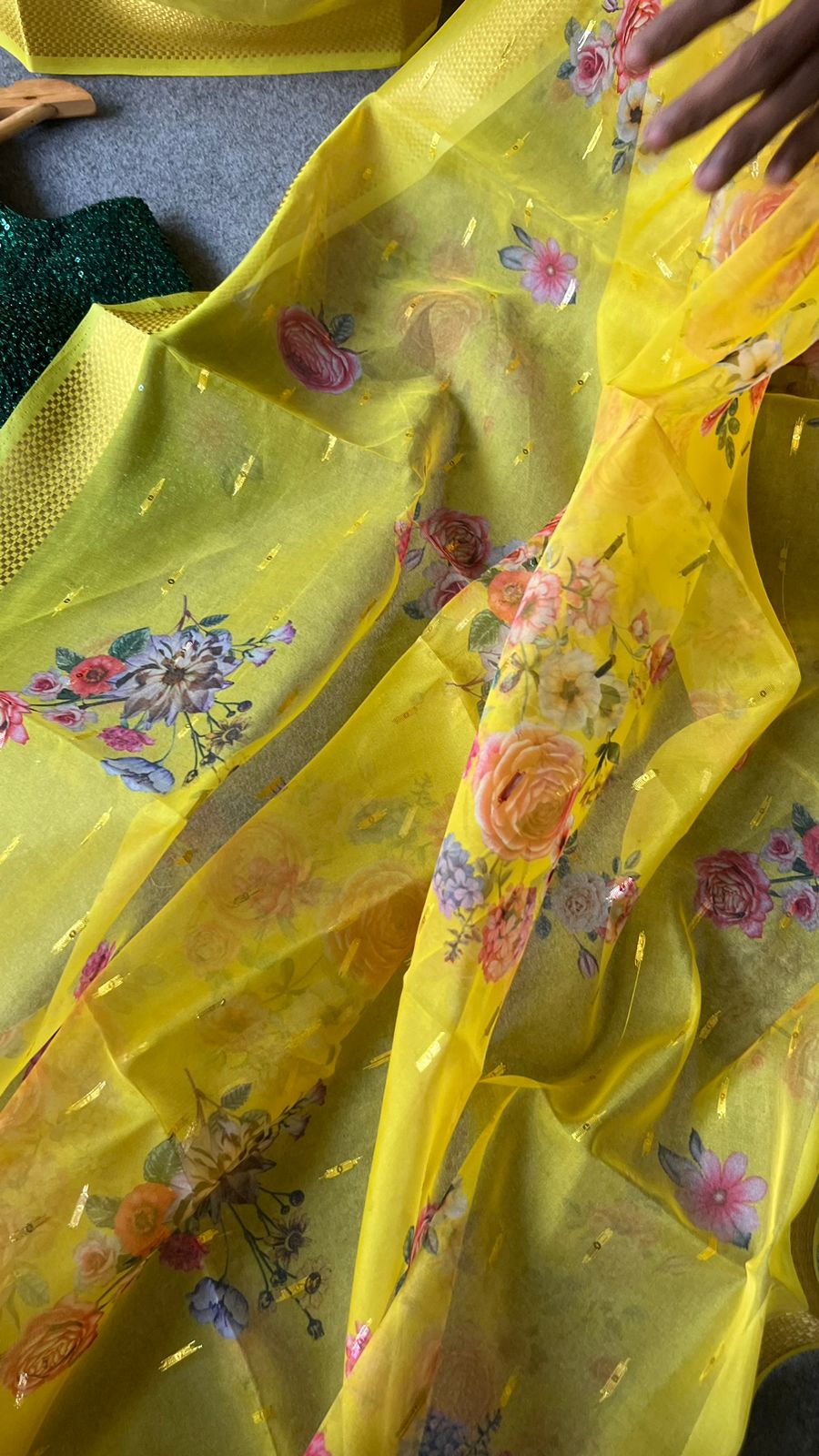 Yellow organza saree with green sequins blouse