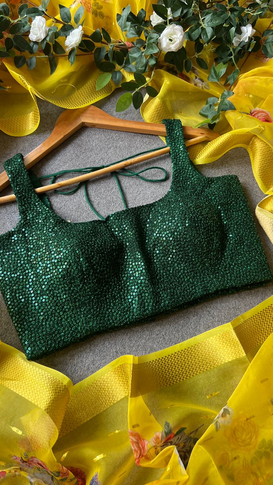 Yellow organza saree with green sequins blouse