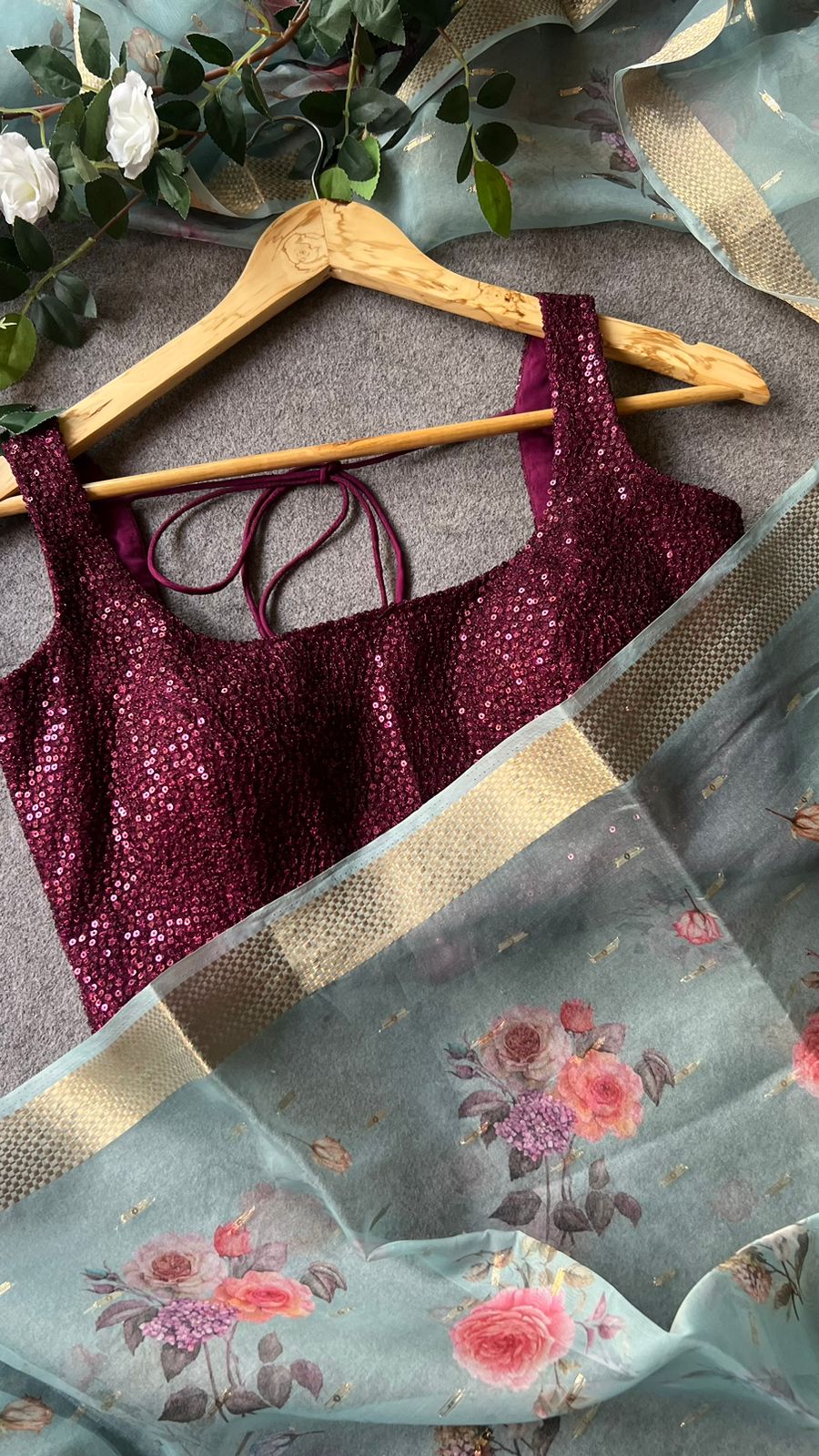 Blue organza saree with wine sequins blouse