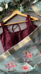 Blue organza saree with wine sequins blouse