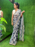 Grey chiffon printed saree with white hand work blouse