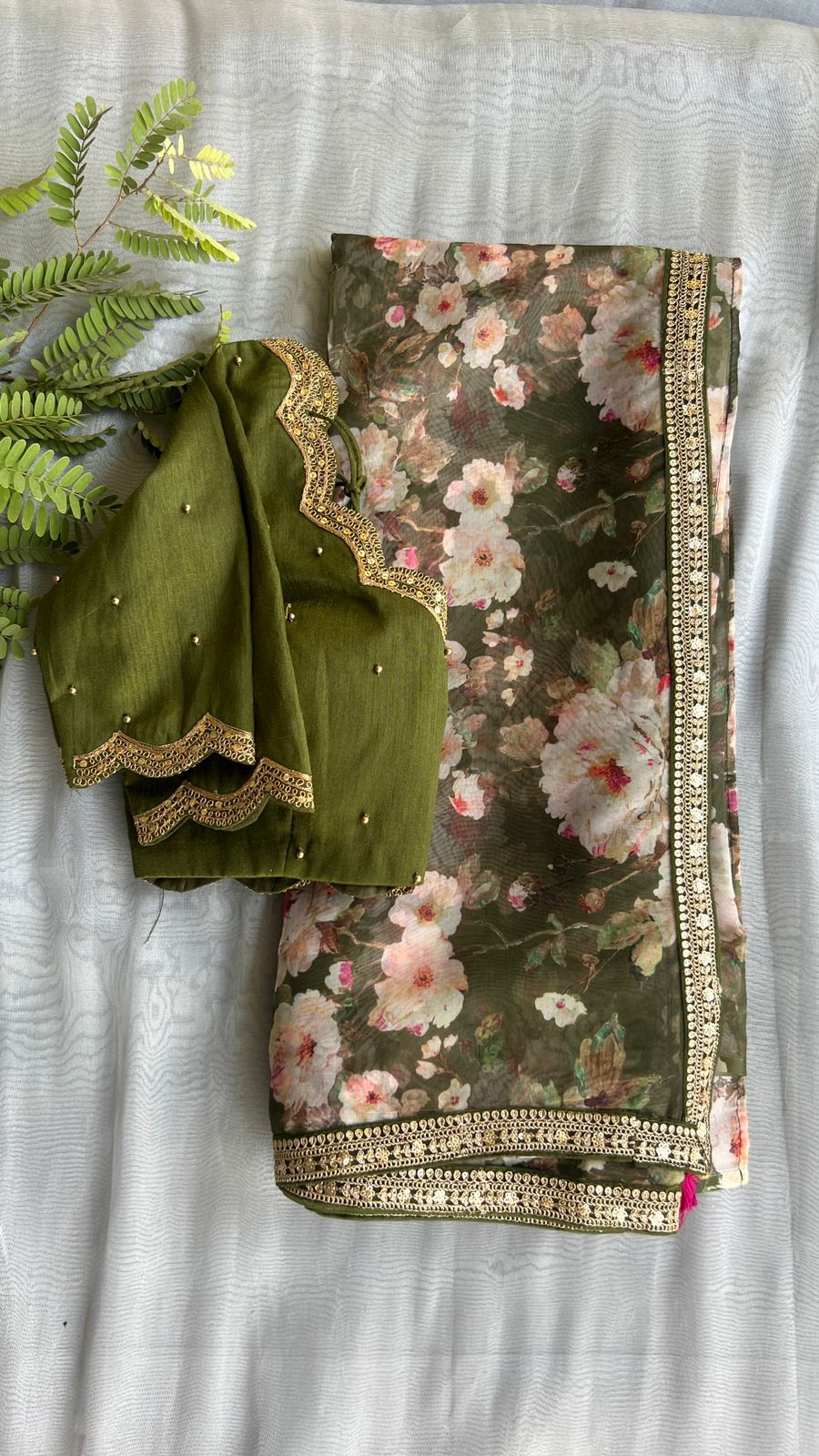Green floral organza saree with mehandi embroidered blouse