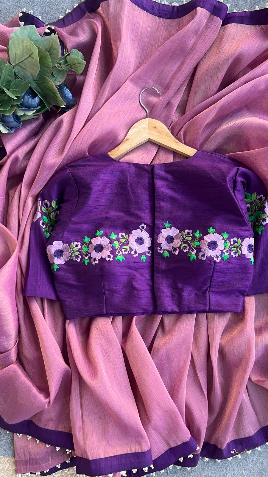 Pink tissue saree with purple embroidery work blouse