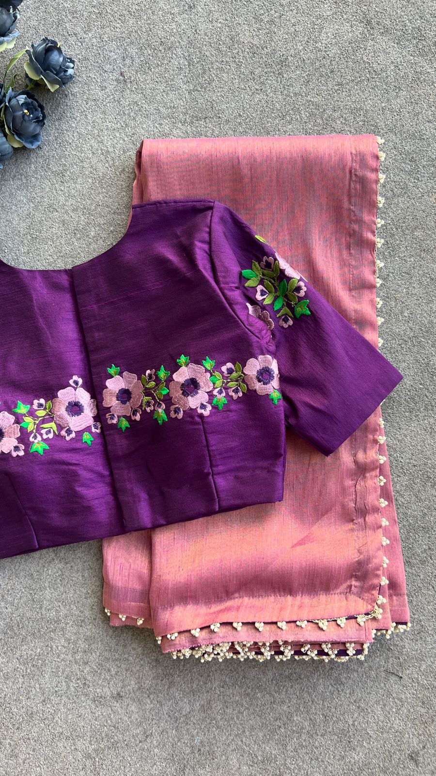 Pink tissue saree with purple embroidery work blouse