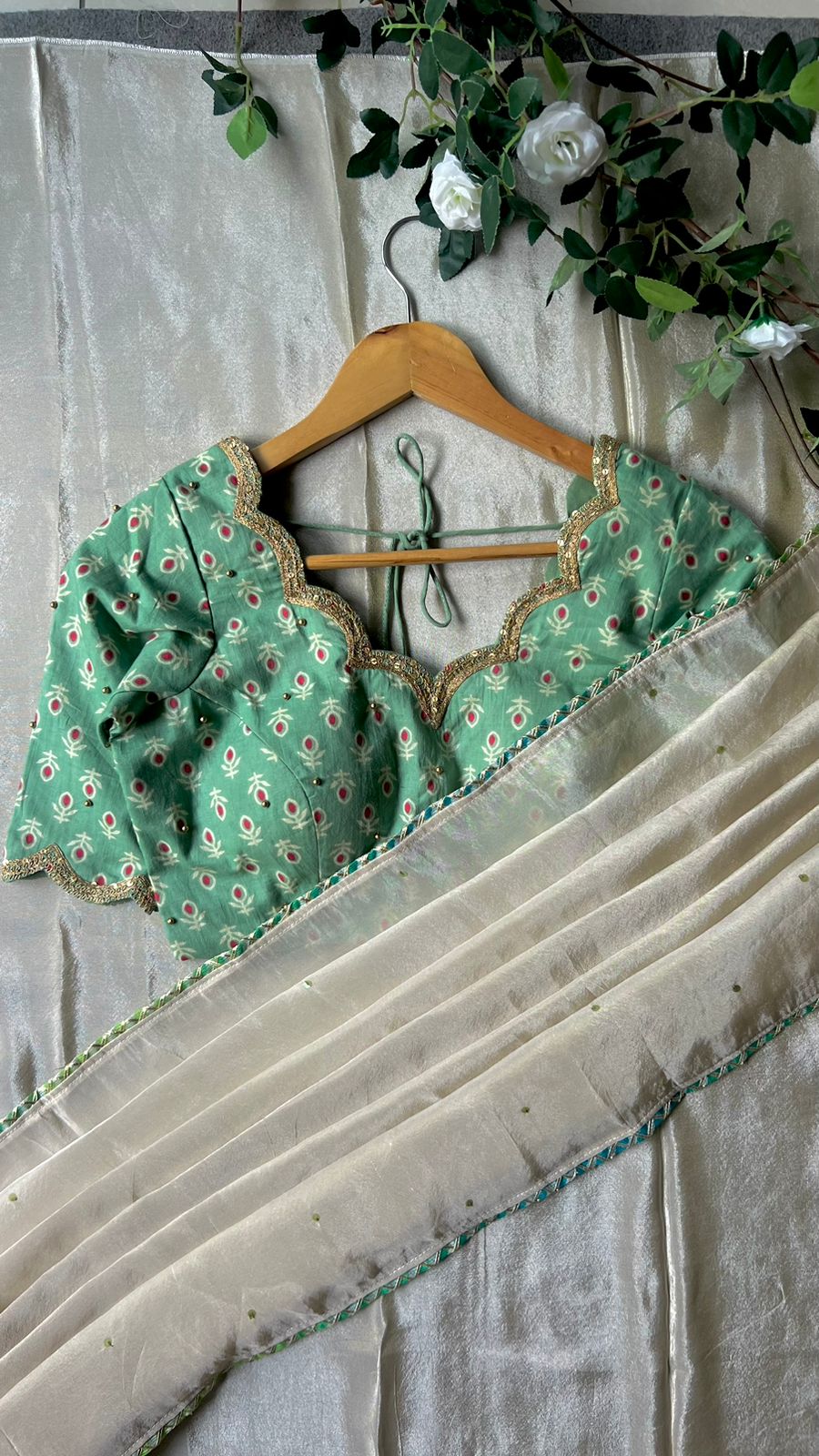 Beige silk designer saree with pista green embroidered blouse