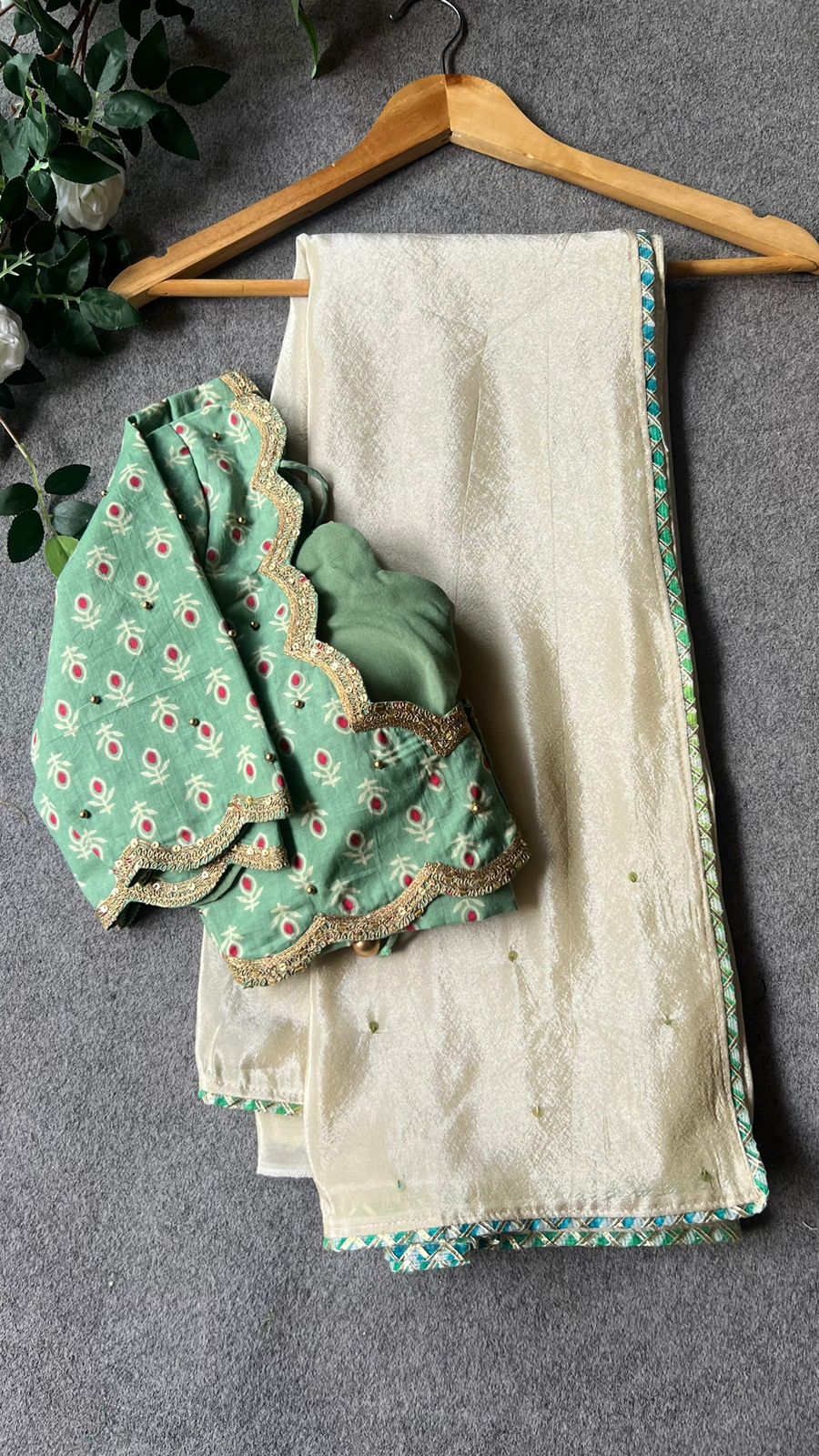 Beige silk designer saree with pista green embroidered blouse
