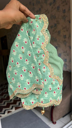 Beige silk designer saree with pista green embroidered blouse