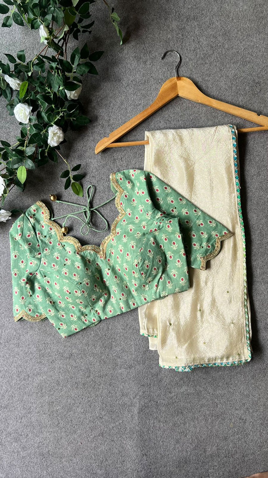Beige silk designer saree with pista green embroidered blouse