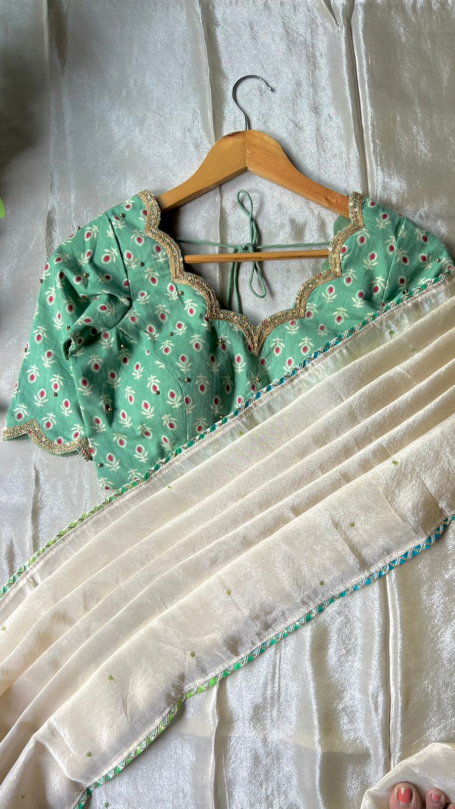 Beige silk designer saree with pista green embroidered blouse