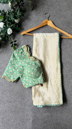 Beige silk designer saree with pista green embroidered blouse