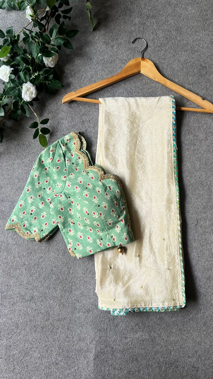 Beige silk designer saree with pista green embroidered blouse