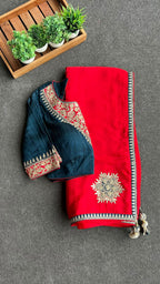 Red textured silk saree with heavy embroidery blouse