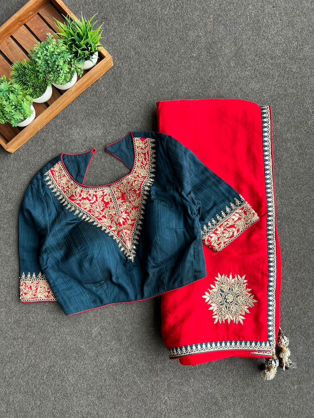 Red textured silk saree with heavy embroidery blouse