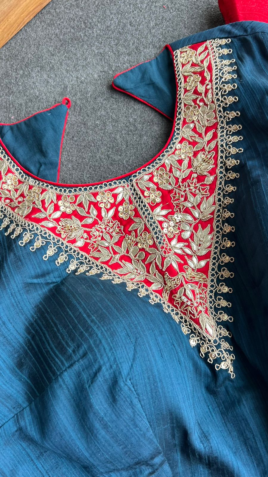 Red textured silk saree with heavy embroidery blouse