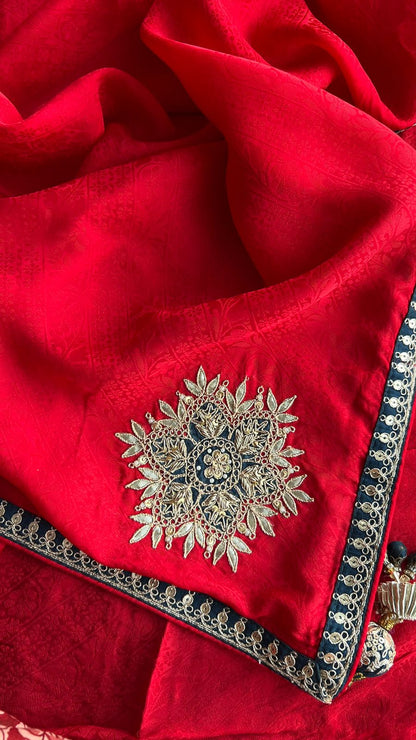 Red textured silk saree with heavy embroidery blouse