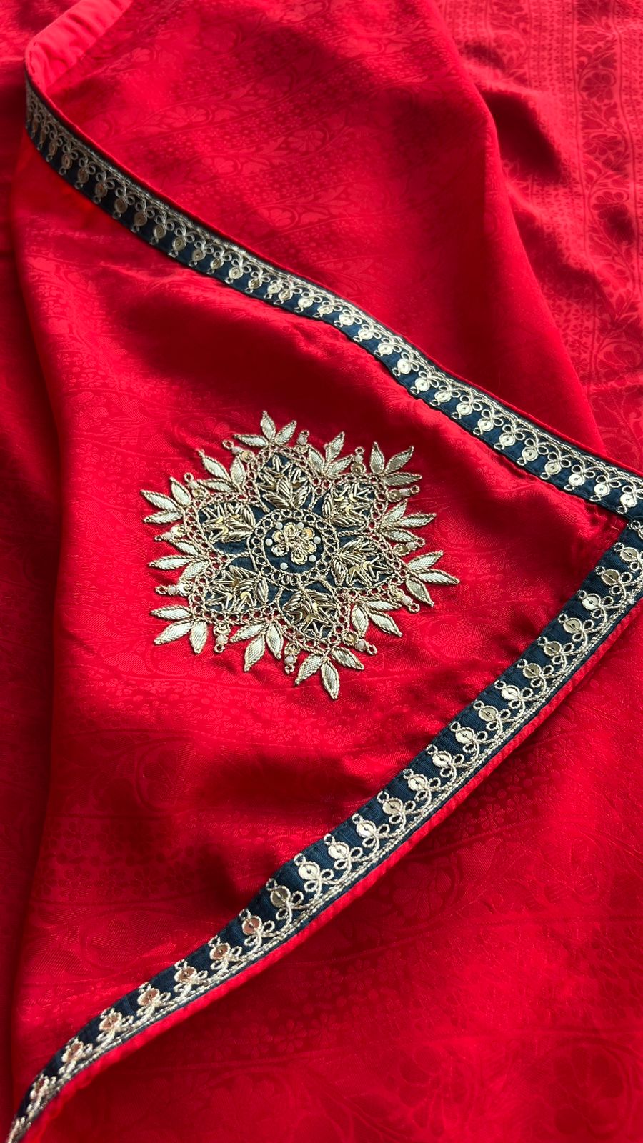 Red textured silk saree with heavy embroidery blouse