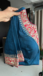 Red textured silk saree with heavy embroidery blouse