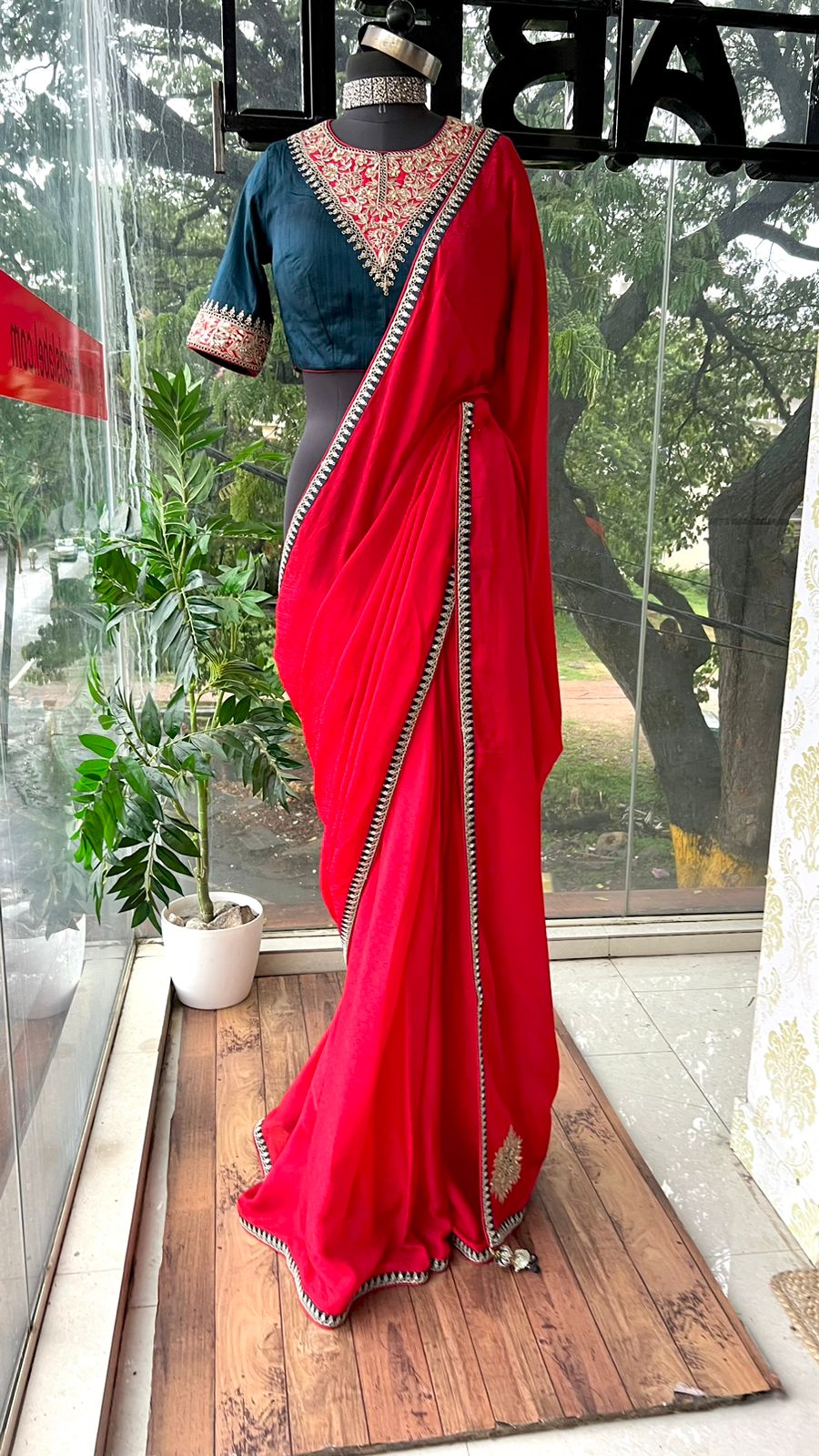 Red textured silk saree with heavy embroidery blouse