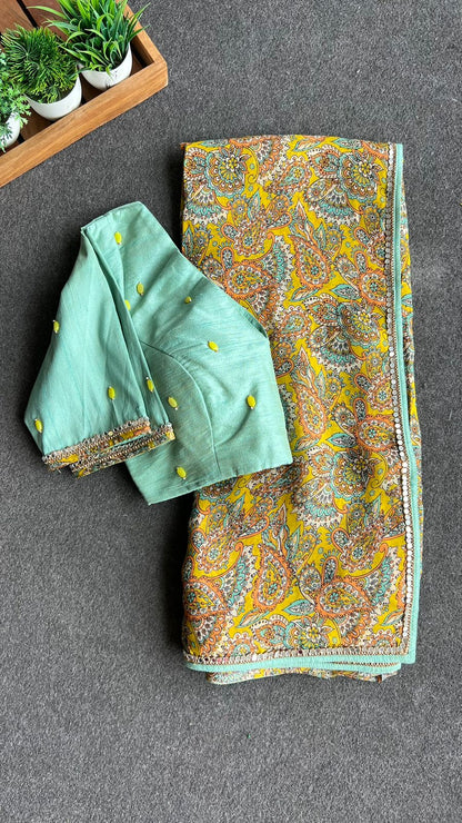 Fenugreek floral organza saree with hand worked blouse