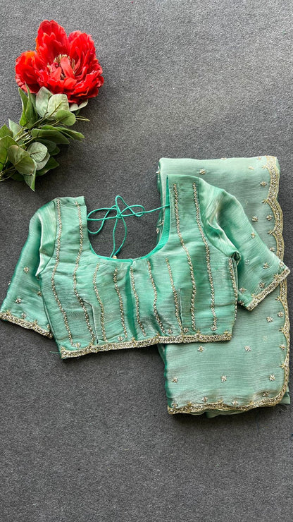 Sea green shimmer silk saree with hand worked blouse