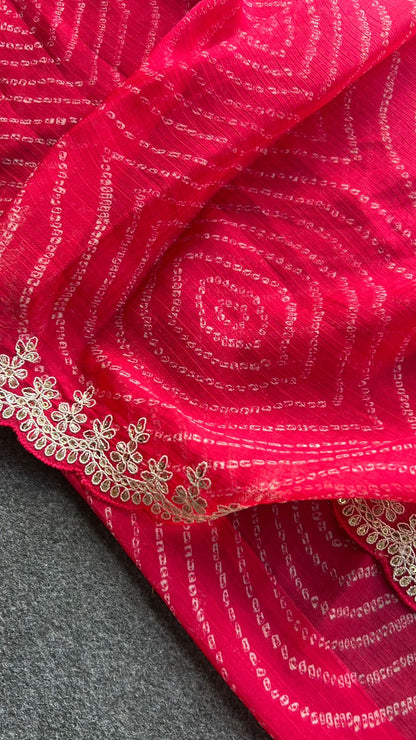 Pink chiffon bandhini saree with white embroidered blouse