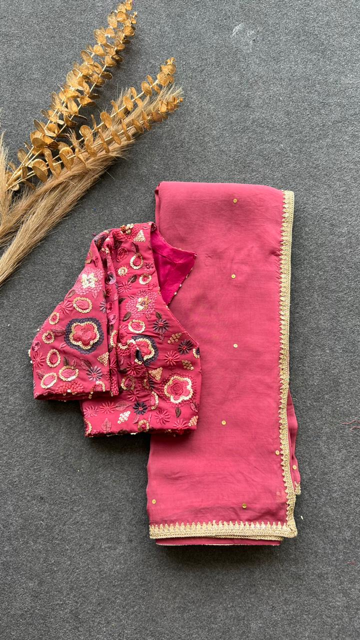 Deep pink organza saree with embroidered blouse