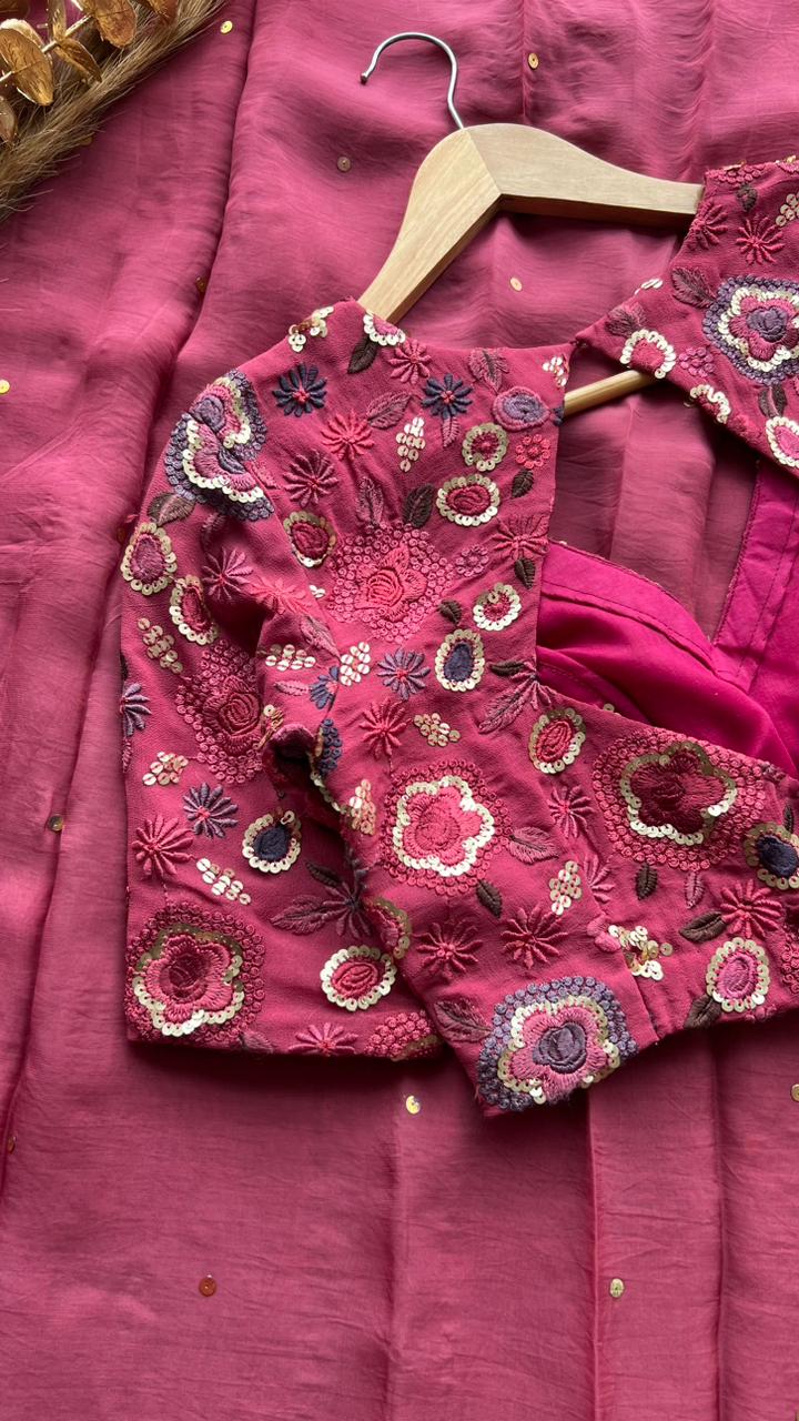 Deep pink organza saree with embroidered blouse