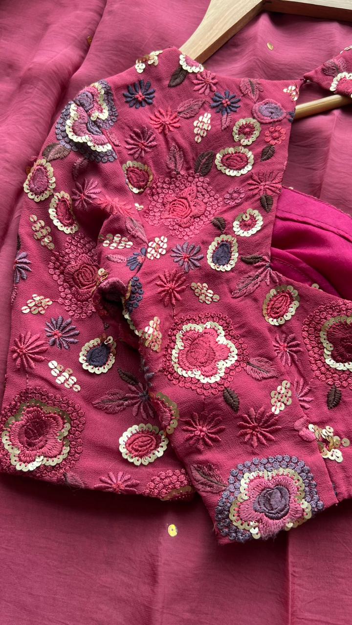 Deep pink organza saree with embroidered blouse