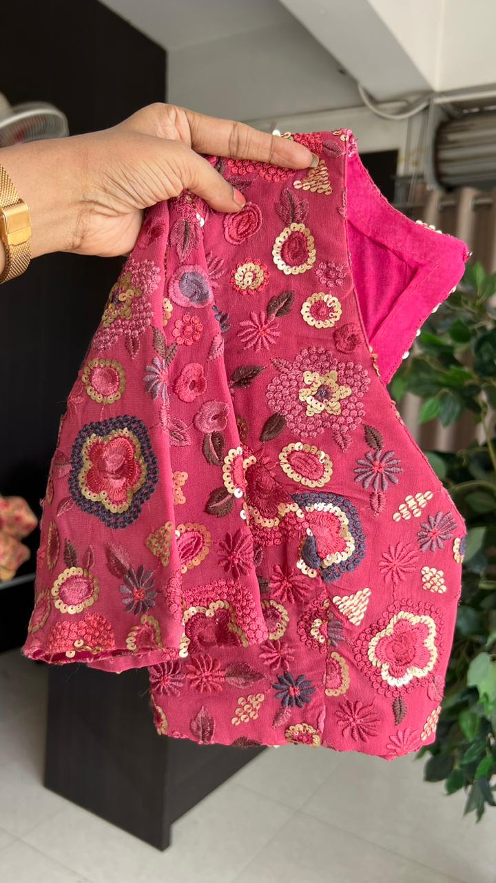 Deep pink organza saree with embroidered blouse