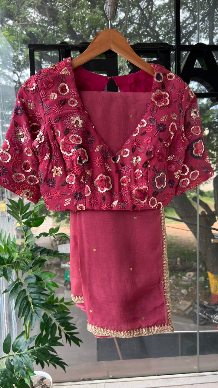 Deep pink organza saree with embroidered blouse