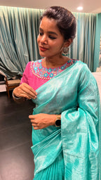 Soft blue tissue saree with pink hand embroidered blouse