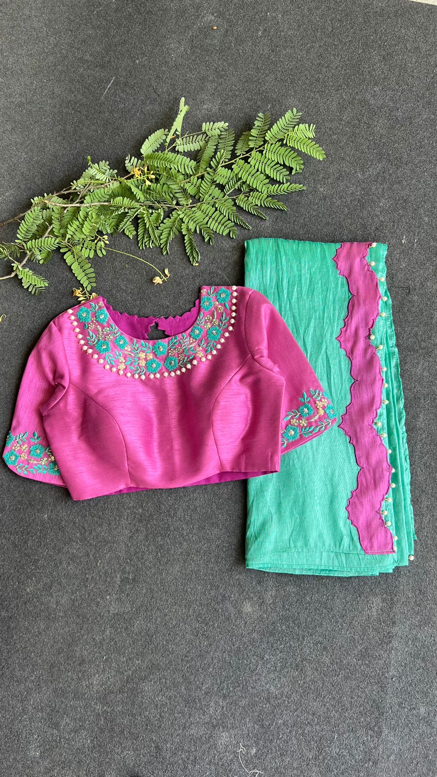 Soft blue tissue saree with pink hand embroidered blouse