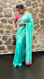 Soft blue tissue saree with pink hand embroidered blouse
