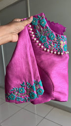 Soft blue tissue saree with pink hand embroidered blouse