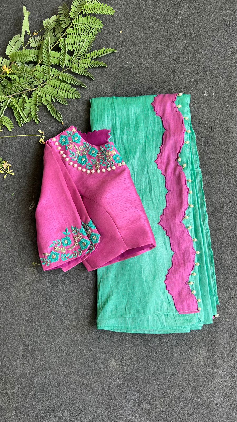 Soft blue tissue saree with pink hand embroidered blouse