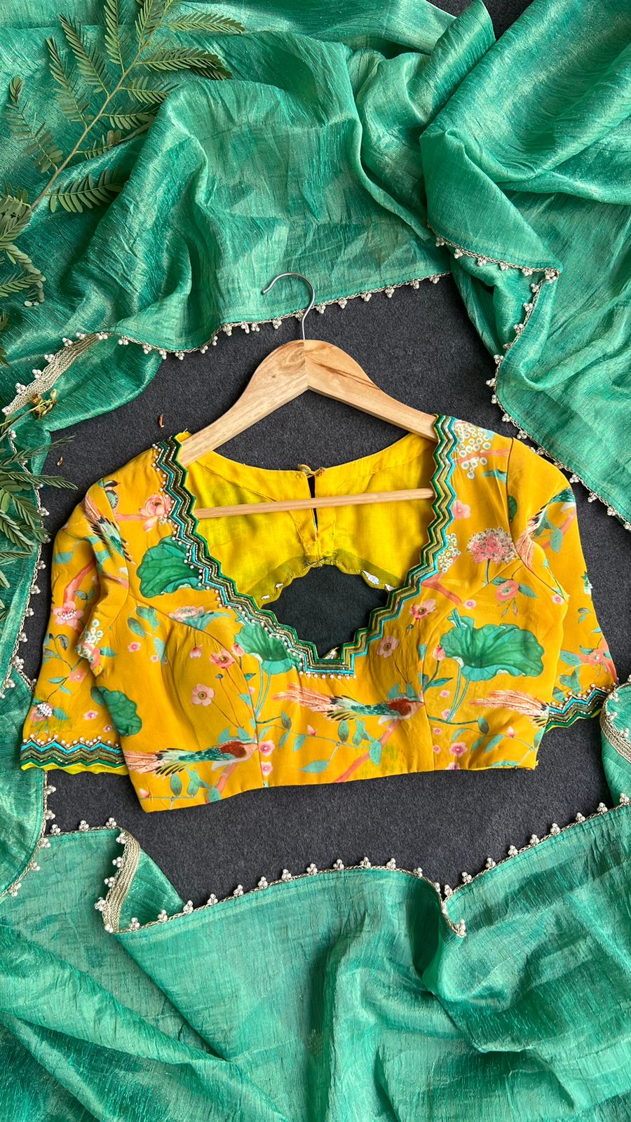 Green tissue saree with yellow floral hand worked blouse