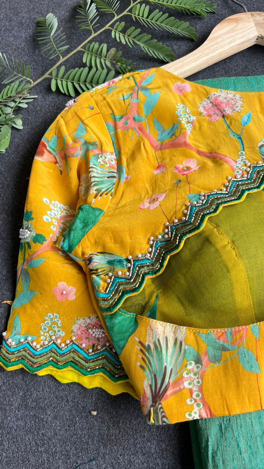 Green tissue saree with yellow floral hand worked blouse