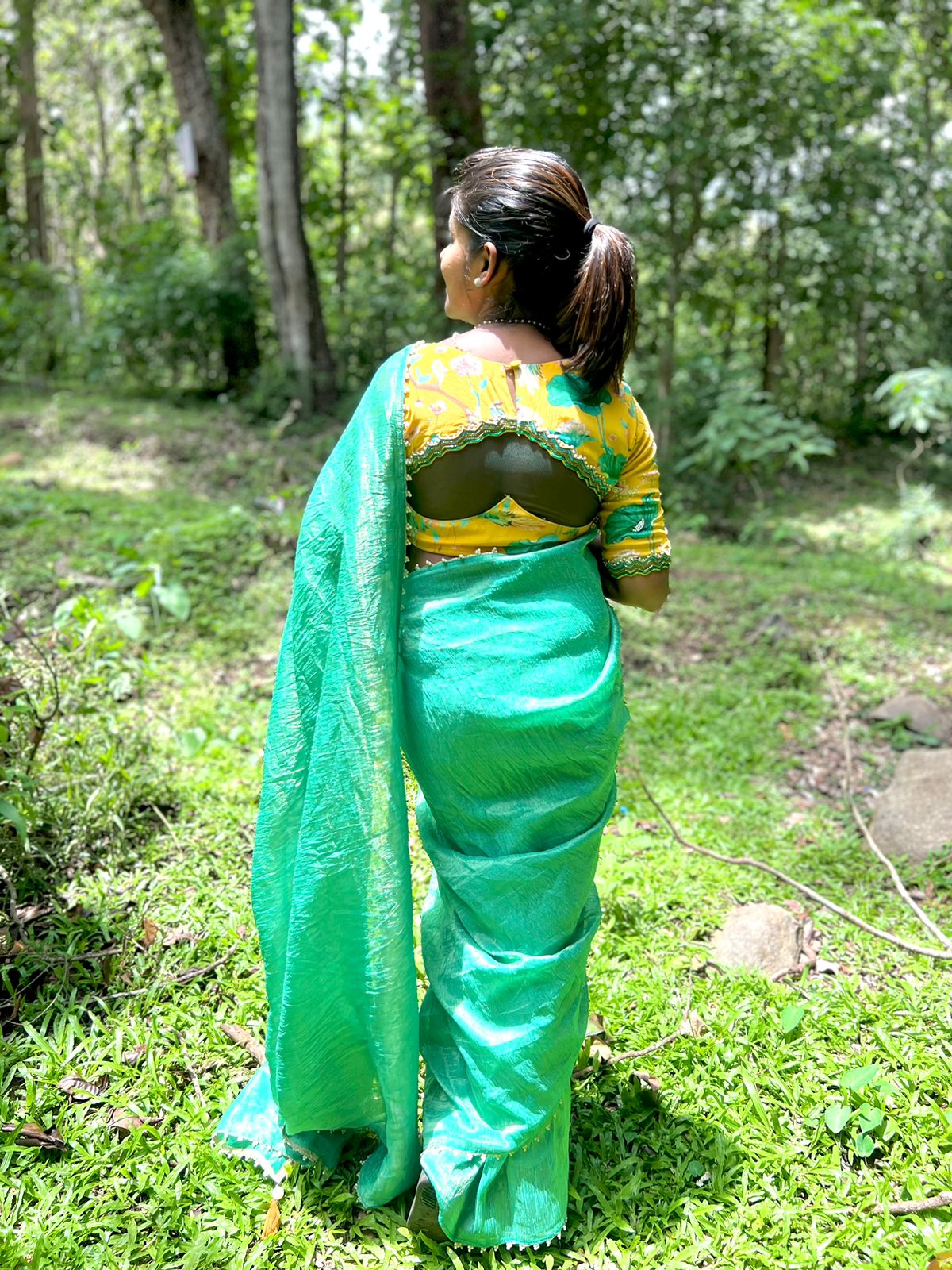 Green tissue saree with yellow floral hand worked blouse