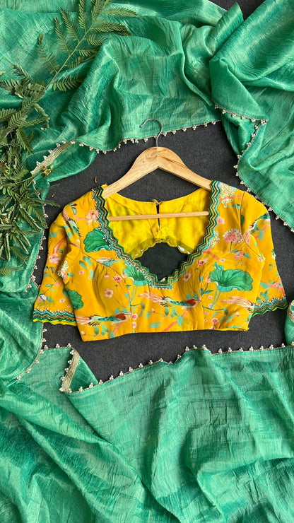 Green tissue saree with yellow floral hand worked blouse