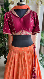 Orange & maroon banarasi hand painted & embroidered lehenga