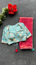 Pink soft tissue saree with blue hand worked blouse