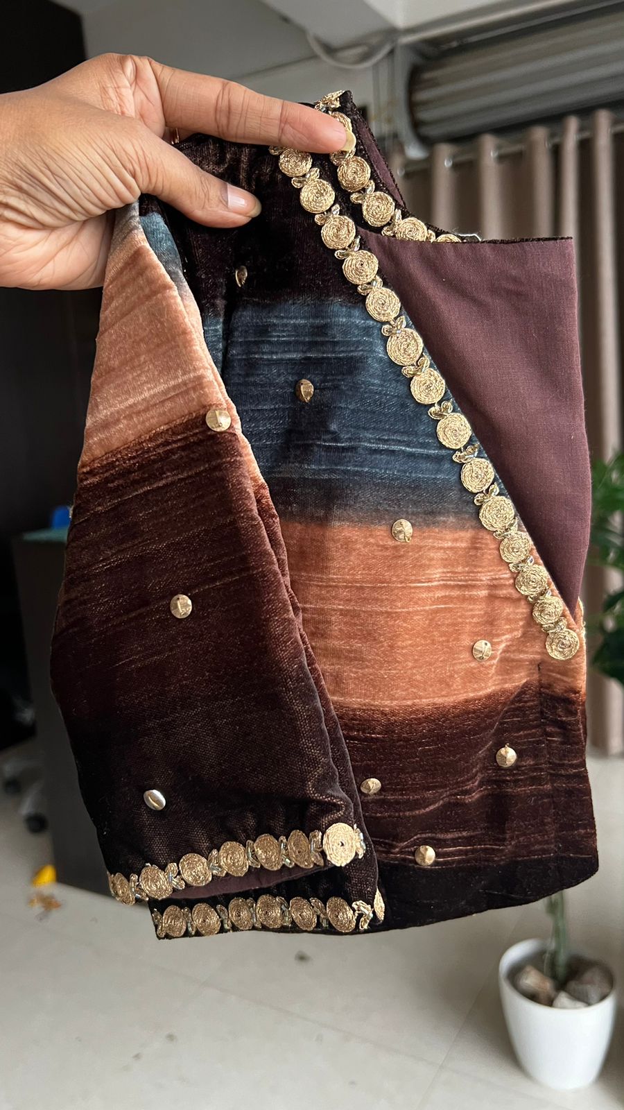 Blue organza saree with stripe velvet blouse