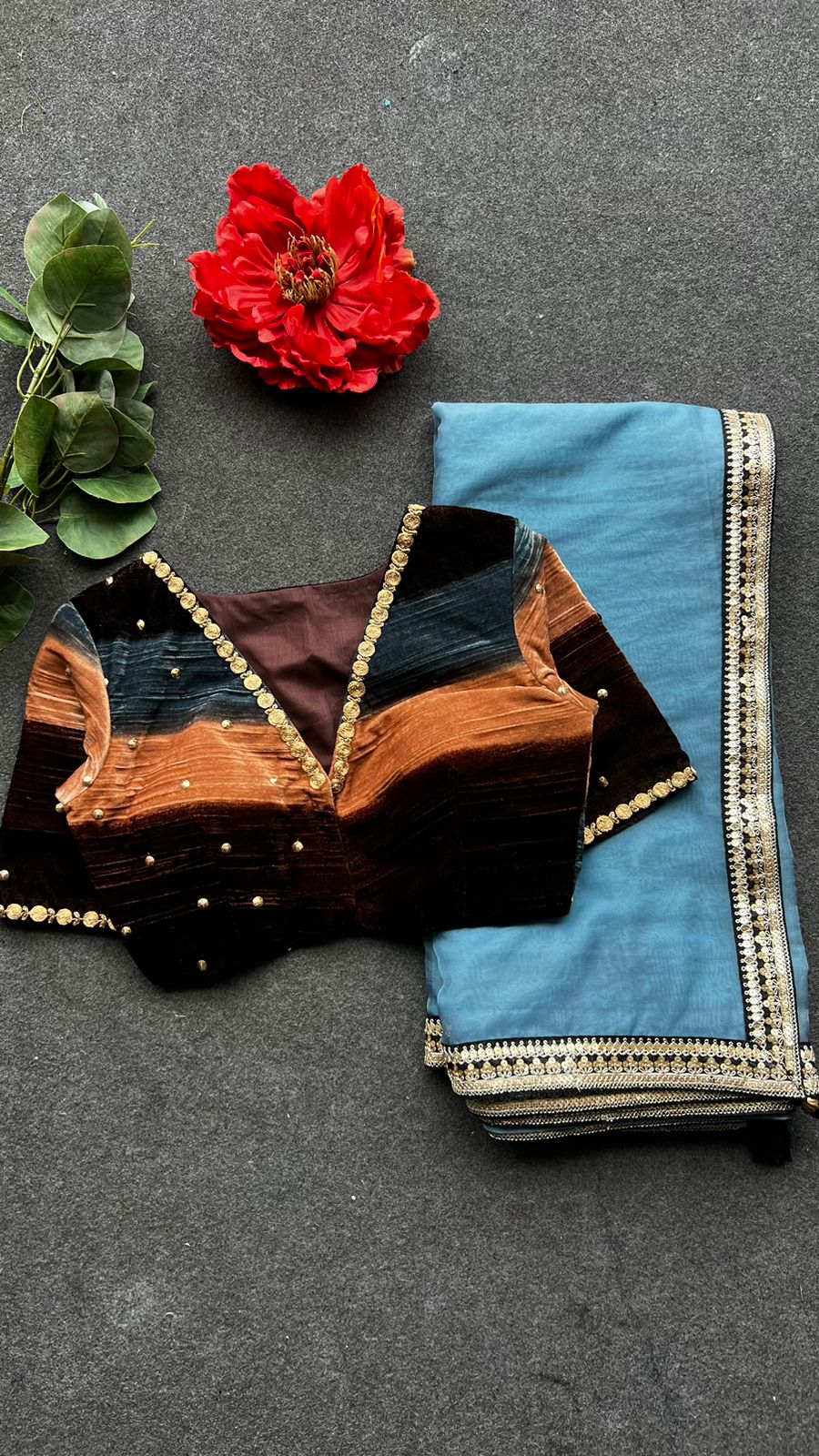 Blue organza saree with stripe velvet blouse
