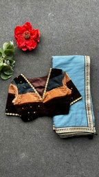 Blue organza saree with stripe velvet blouse