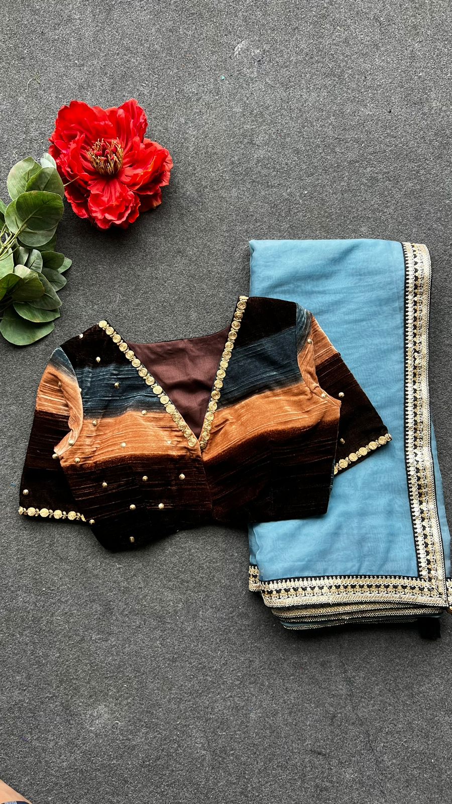 Blue organza saree with stripe velvet blouse